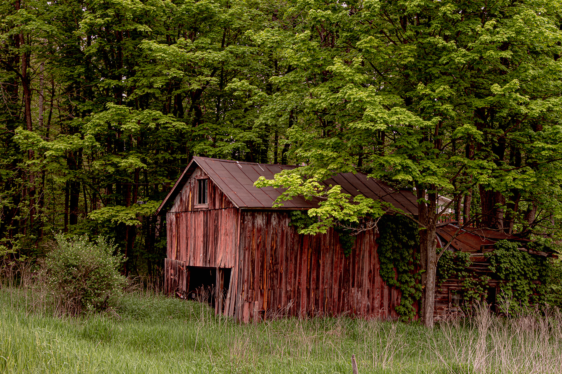 An ancient barn with adjoining log cabin