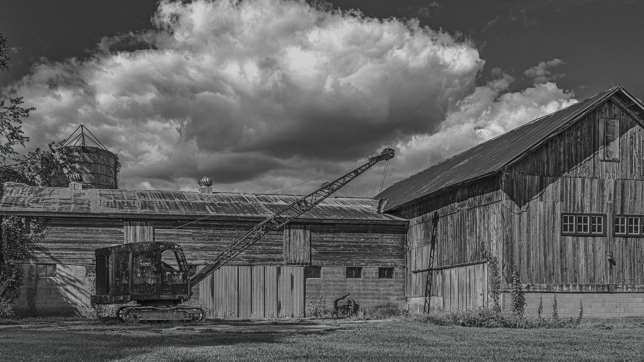 The classic barn with a rusty old crane, revisited in black and white