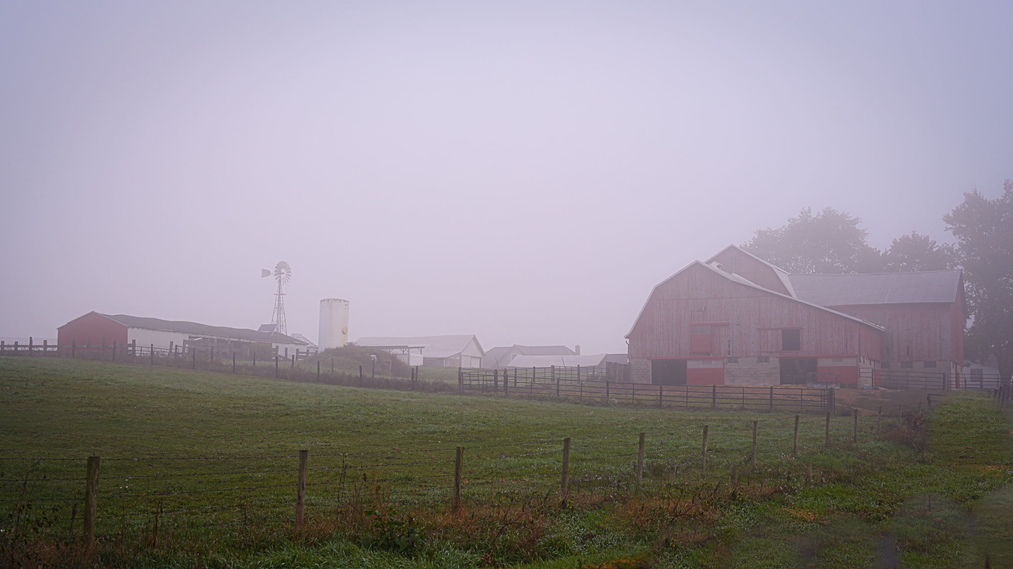 An early morning fog on this Amish farm in rural Elkhart County Indiana.